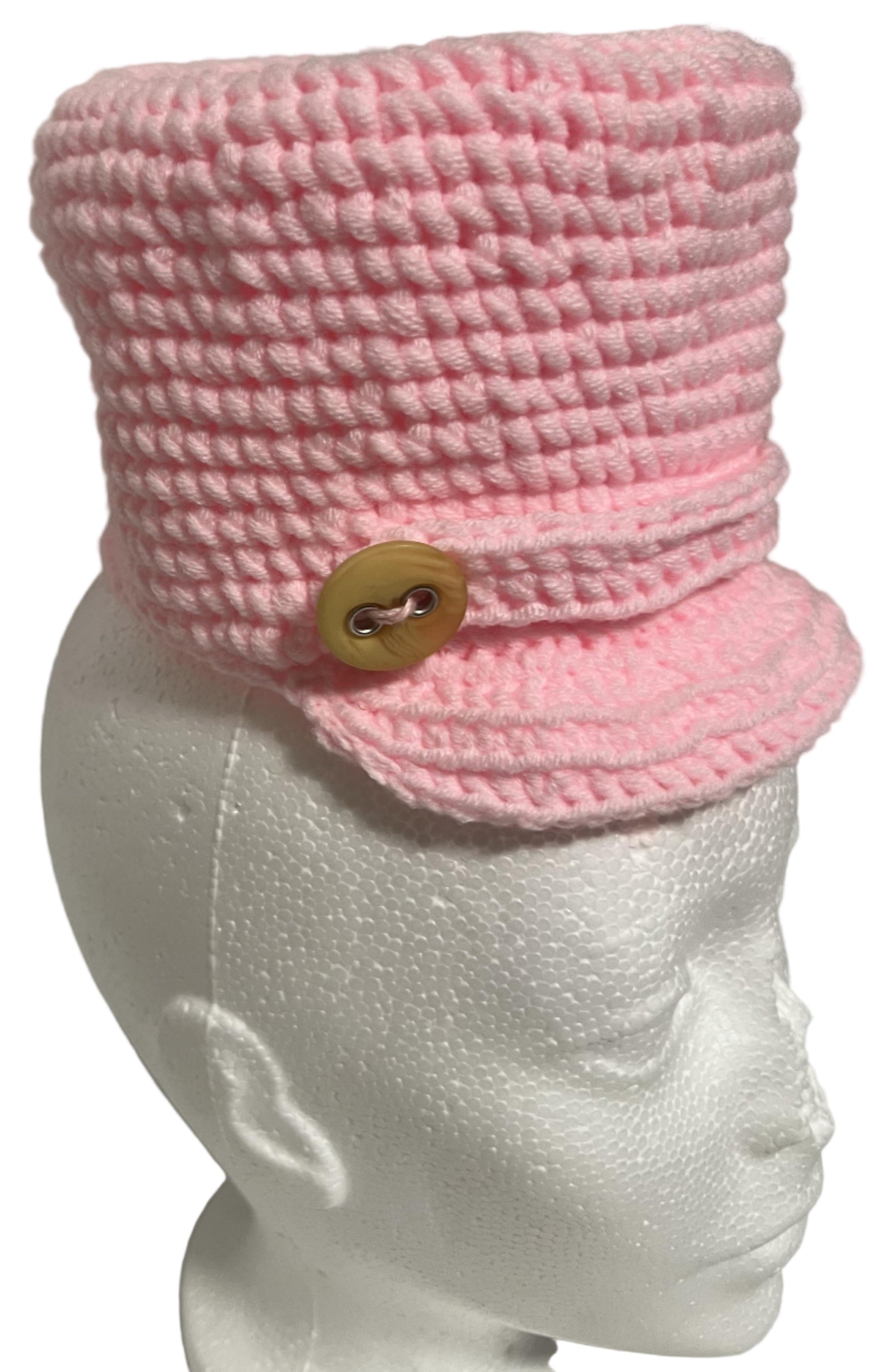 Unique handmade kids winter hat in pink with a button detail for warmth and style