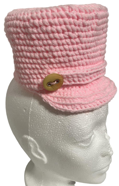 Unique handmade kids winter hat in pink with a button detail for warmth and style